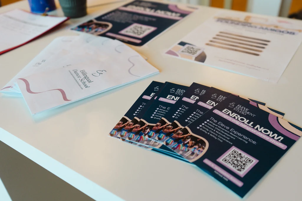 Eleve ballet studio brand identity and printed collateral arranged on a desk