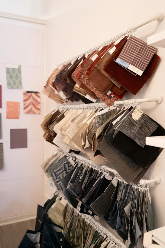 A curated selection of textiles and material samples for Kline Interiors